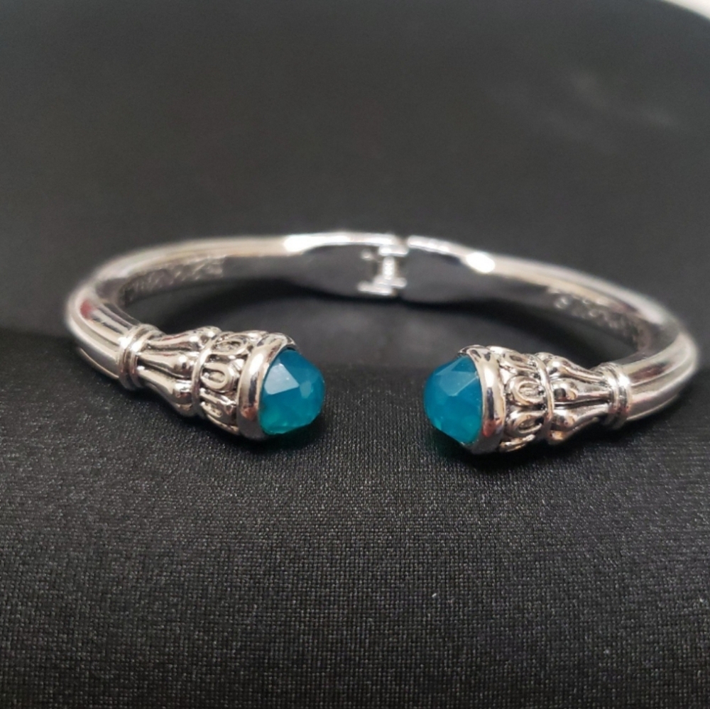 Fashion Silver Hinged Bracelet With 2 Blue Faux Crystals.